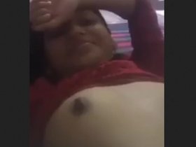 A lovely girl indulges in self-pleasure and displays her skills in fingering