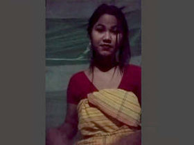 A stunning young woman sensually pleasuring herself