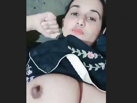 Pakistani wife with large breasts seductively unveils her allure