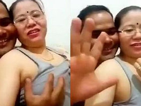 Nepali auntie records herself getting her breasts fondled by her husband with explicit audio
