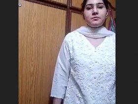 Alluring stripping from professional seductress in business attire