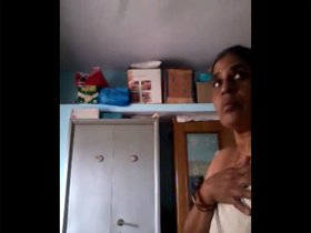 Secretly recorded bhabhi's nude changing session in videos