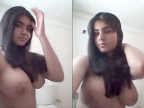 Young Desi girl flaunts her ample breasts and seductive charm