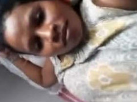 A seductive girl revealing her breasts and intimate parts