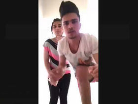 Aroused non-professional pair engages in standing intercourse