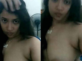 Young Indian college girl reveals her breasts in a recorded video