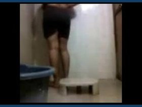 Mangala bhabhi's intimate moment in the bathroom while disrobing