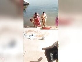 Shameless Desi bhabhi poses topless on the riverbank in XXX video