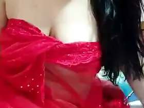 In a red mesh sari showing off her boobs and hips on StripChat Live