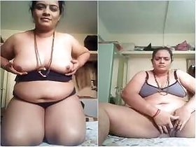Horny Desi Bhabhi Sucking her tits and jerking off with her fingers