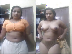 Sexy Indian Bhabhi strips naked and shows her tits and pussy